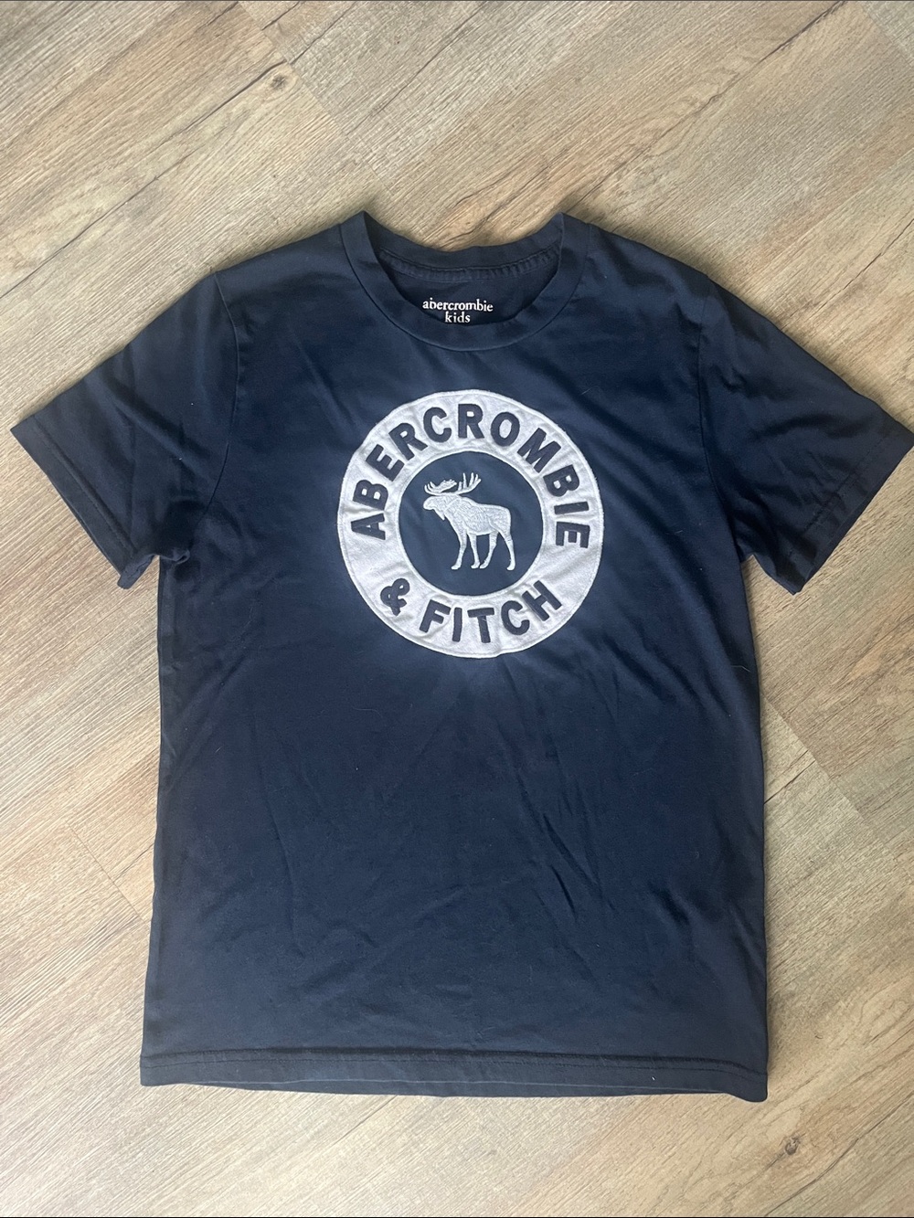 Vintage abercrombie kids navy tee with white circular moose logo